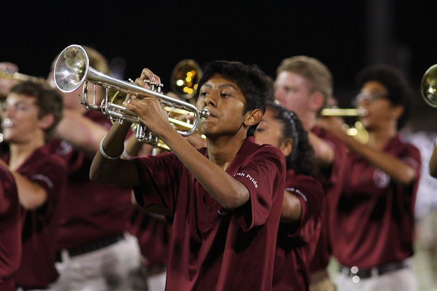 Junior Freddy Cruz plays his trumpet during the halftime show.