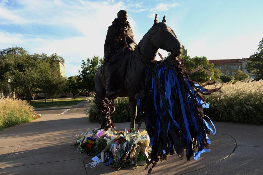 Black and blue crepe paper is wrapped around Soapsuds on the campus of Texas Tech University.