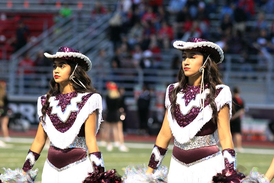 Sophomore Farmerettes Tatiana Neito and Senior Susan wait for the game to begin.