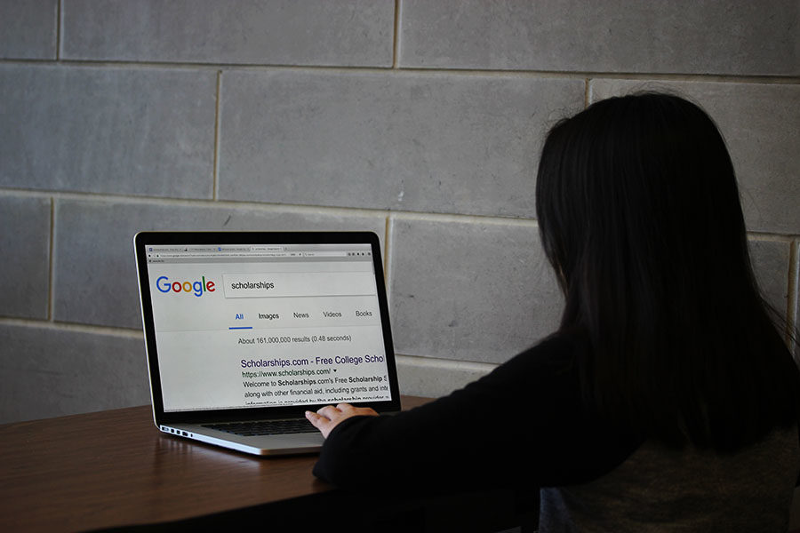 A student searches for scholarships on Google.