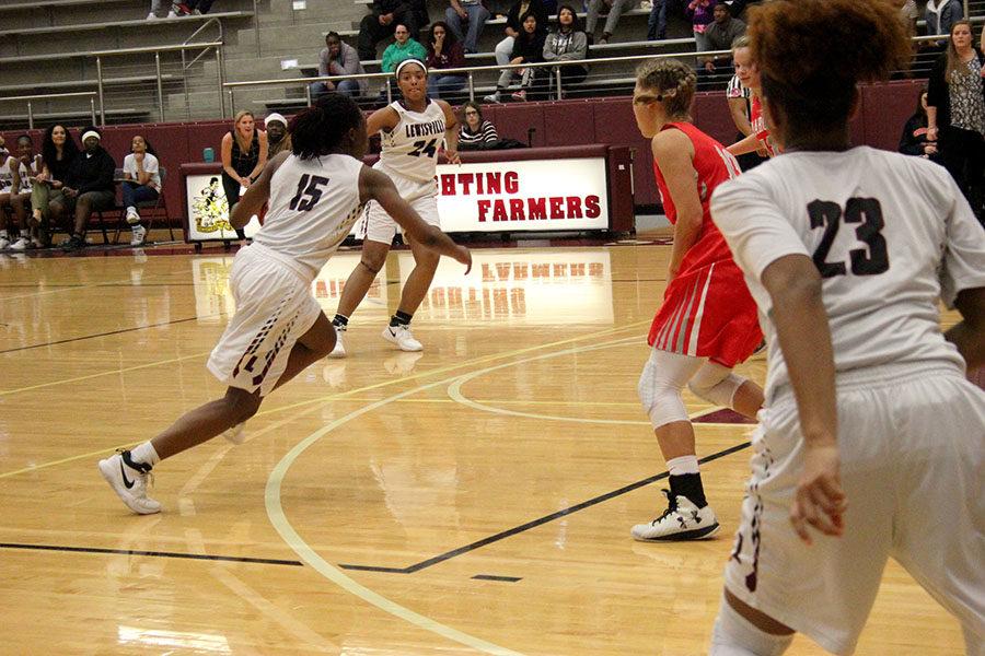 Junior Nala Hemingway (15) runs the play during the game against Marcus on Tuesday, Dec. 19.