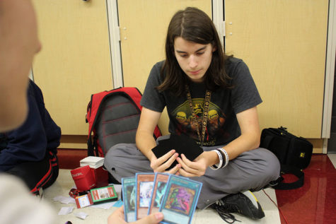 Senior Simon Duncan competes in a Yu-Gi-Oh! placement tournament during lunch on Thursday, March 1.