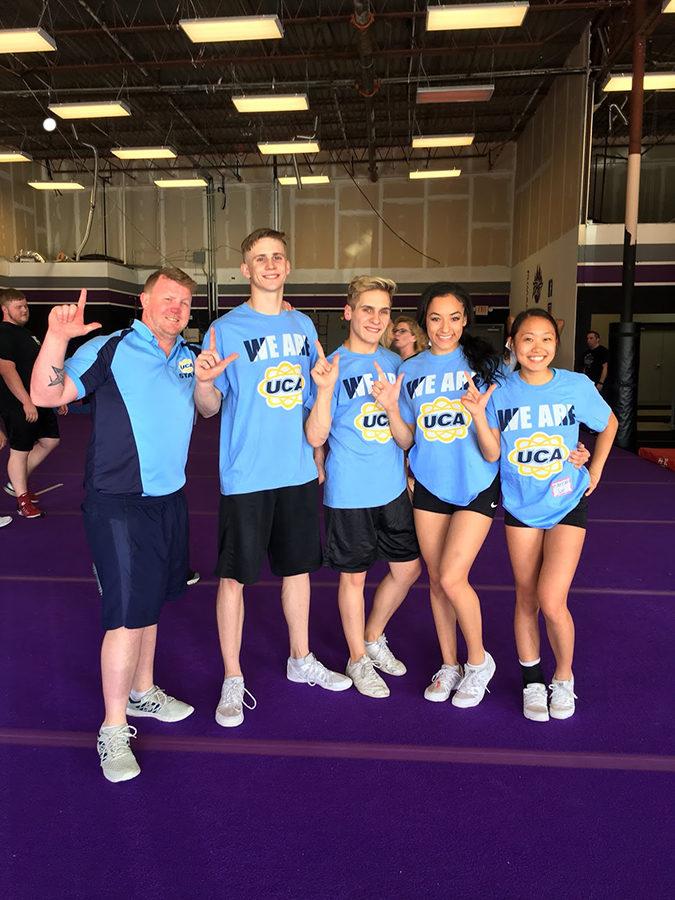 A Universal Cheerleading Association representative and seniors (left to right) Landyn Gage, Tyler Carver, Trinity Kulow, Hannah Son pose after being selected. Courtesy of Lewisville Cheer. 
