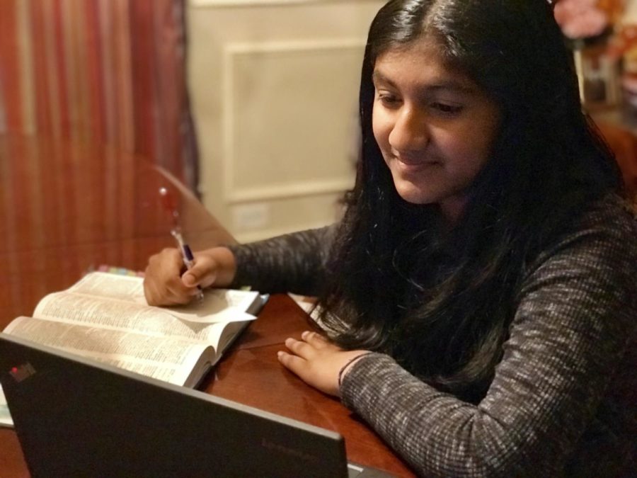 Sonika Harish writes down new vocabulary words while studying.
Courtesy of Esha Harish