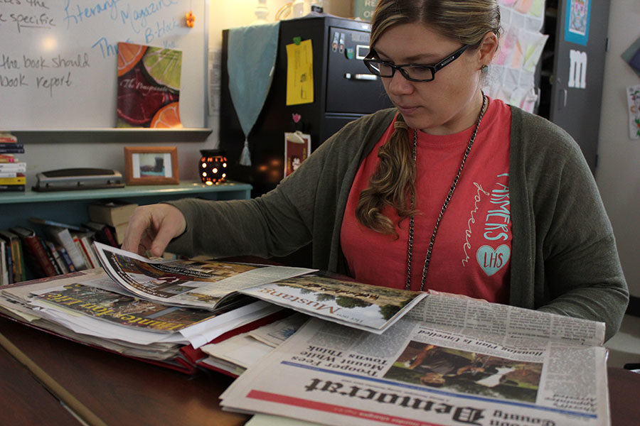 English teacher Mary Davenport reads a collection of her articles.