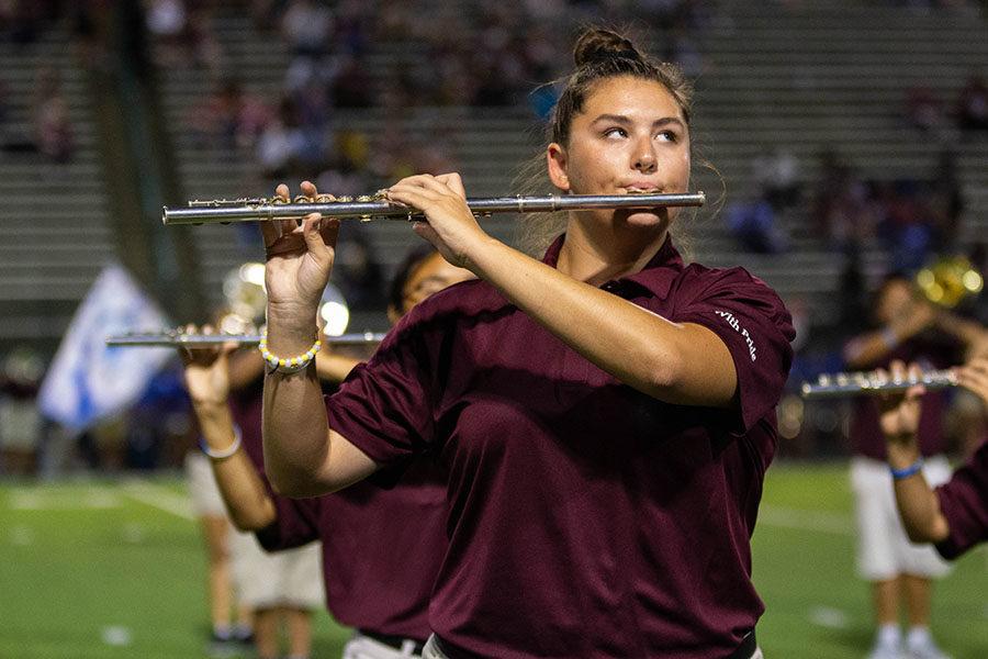 Sophomore flute player Allison Durocher performs during the halftime show.