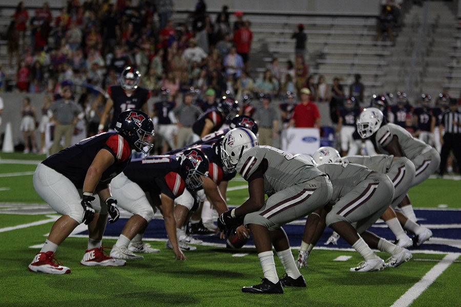 The football team lines up for a defensive play at the away game against McKinney Boyd on Thursday, Sept. 13.