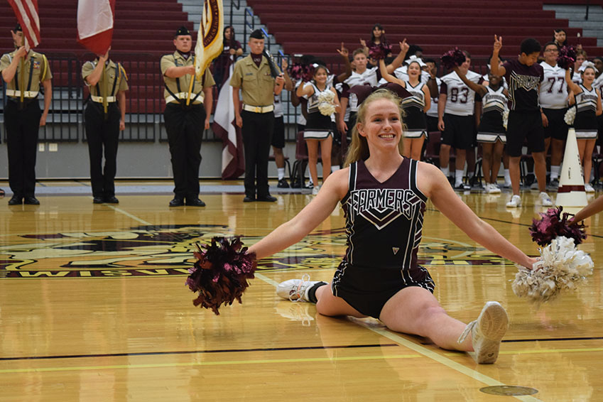 Senior Clara Raper lands her pose at the end of the cheer show.