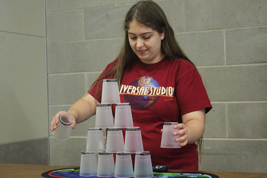Senior Sarah Raptis begins to stack her cups.