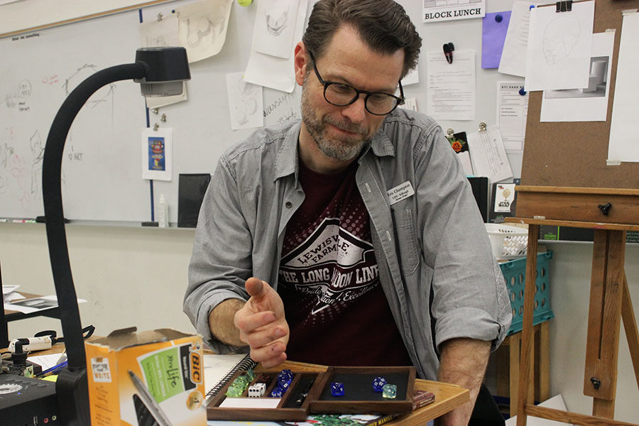 Killough+art+teacher+Eric+Champion+rolls+dice+onto+his+own+hand+crafted+box.+