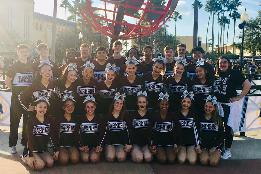 The cheer team poses outside of the ESPN Wide World of Sports Complex in Osceola County, Florida. Courtesy of LHS Cheer.