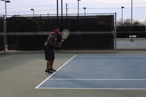 Sophomore Nicholas Ward prepares to receive a serve during practice on Wednesday, Feb. 13. 