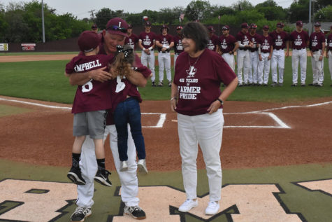 Baseball head coach Mike Campbell celebrates his 45-year career in coaching before the home game against Hebron on Tuesday, April 12.