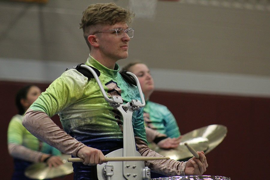 Junior Brett Myers focuses as he plays his snare drum during the community performance on Friday, April 5.