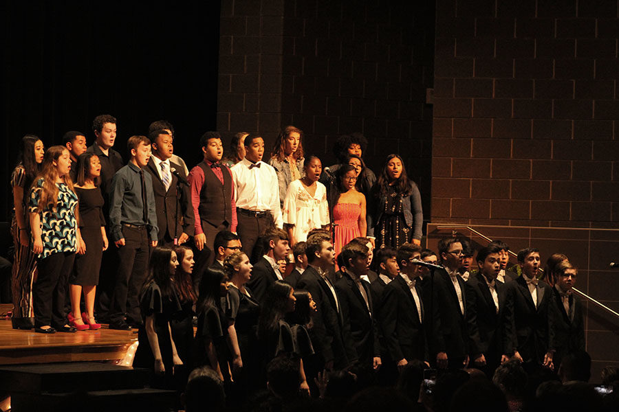 Choir members perform during the senior rosecutting ceremony.