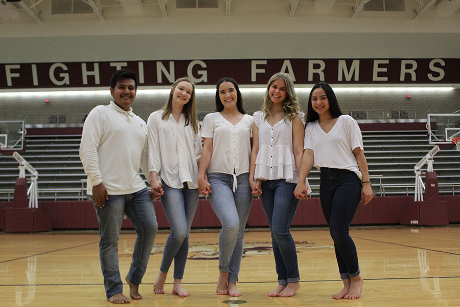 New Farmerette captain, junior Taylor Dill (middle), is surrounded by new senior lieutenants Erick Sanchez, Alexa Wolff, Carolyn Vaughan and junior lieutenant Trinity Darby. 