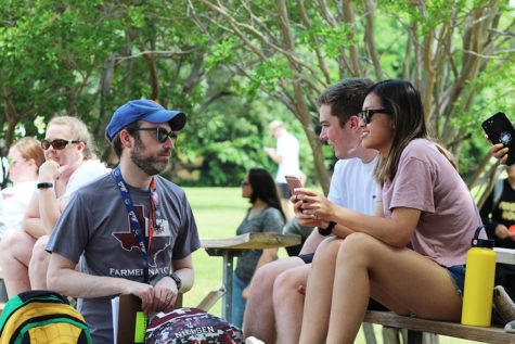 Students talk to former U.S. history teacher Robert Borenstein at the senior picnic in 2019.