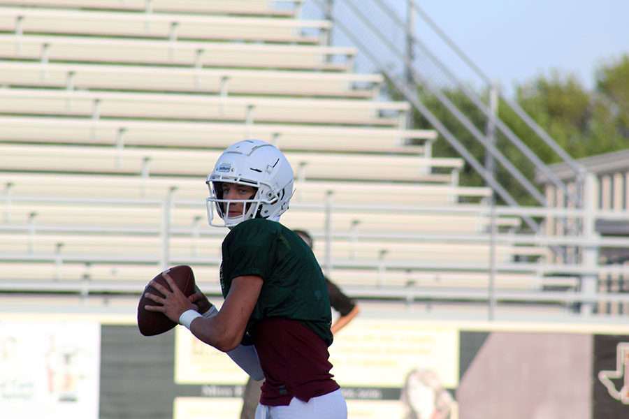 Junior quarterback Landon Webster (7) prepares to throw the ball at the home scrimmage against The Colony on Thursday, Aug. 22.