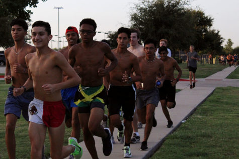 The cross country team practices a long run at Harmon campus before school on Friday, Sept. 13.