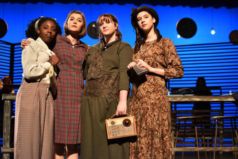 Juniors Eliana Jones and Madelyn Bloom and seniors Cadence Hindman and Sophia Cauduro pose together as the radium girls during a scene. Photo courtesy of Dawn Clyburn.