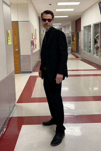 Art teacher Eric Champion poses for a picture while wearing his outfit for Black Out on Friday, Nov 8. Courtesy of Ysabela Abundis.