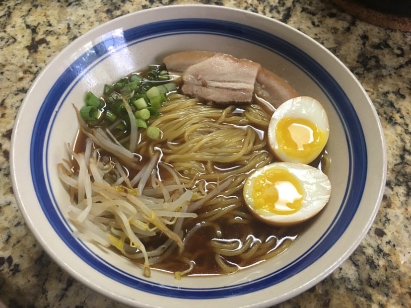 A bowl of Shoyu Ramen, one of senior Erick Nguyens favorite dishes to both cook and eat, sits on a counter.