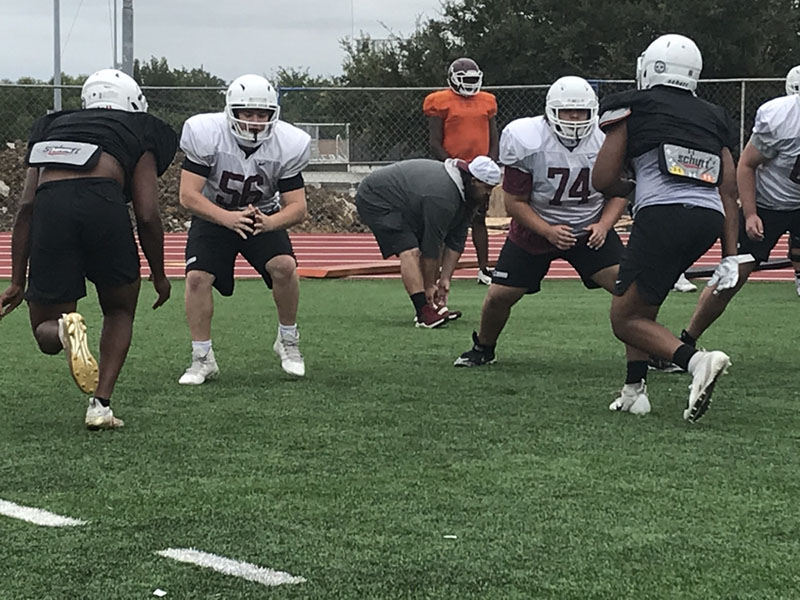 Seniors Michael Coronati (56) and Damarea Sheppard (74) complete a lineman drill during practice on Thursday, Sept. 10.