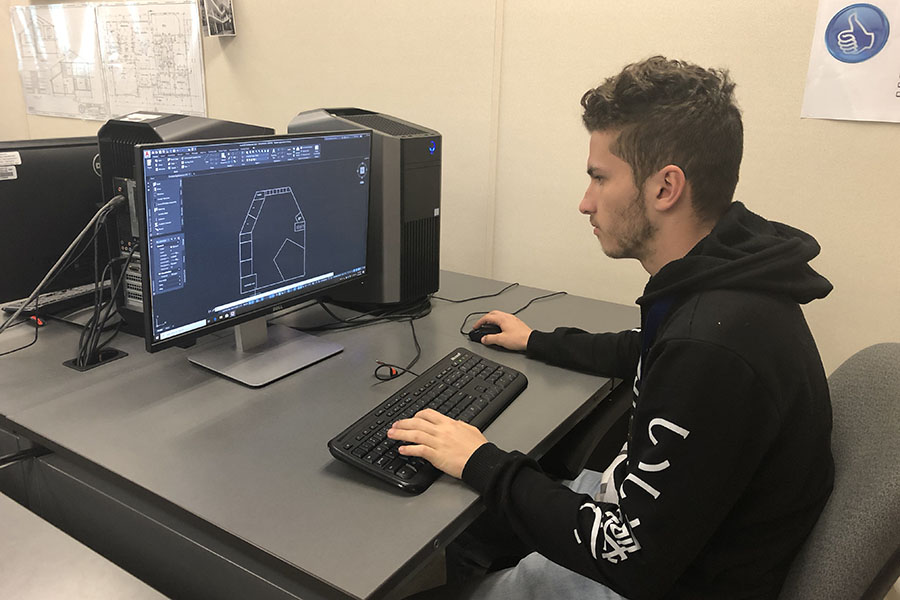 Senior Jagger Odom works diligently on a design for the Technology Student Association on Tuesday, March 10. Courtesy of Jagger Odom.