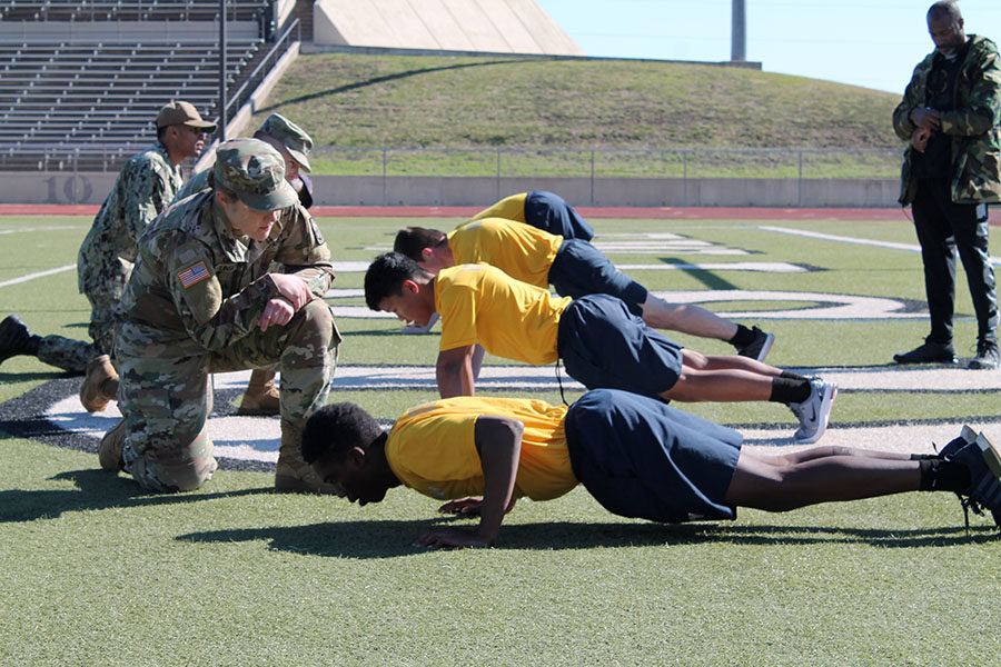 NJROTC students perform push ups at the Cowtown Classic Drill on Friday, Nov. 1. Courtesy of Mark Ortiz.