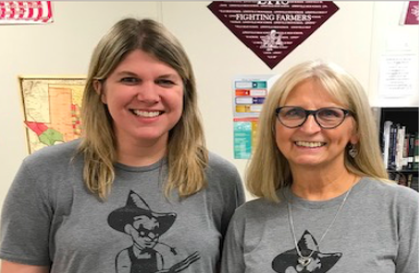History teachers Sarah Dowdy and Bessie Alexander pose for a photo in their matching Farmer shirts. Courtesy of Bessie Alexander.