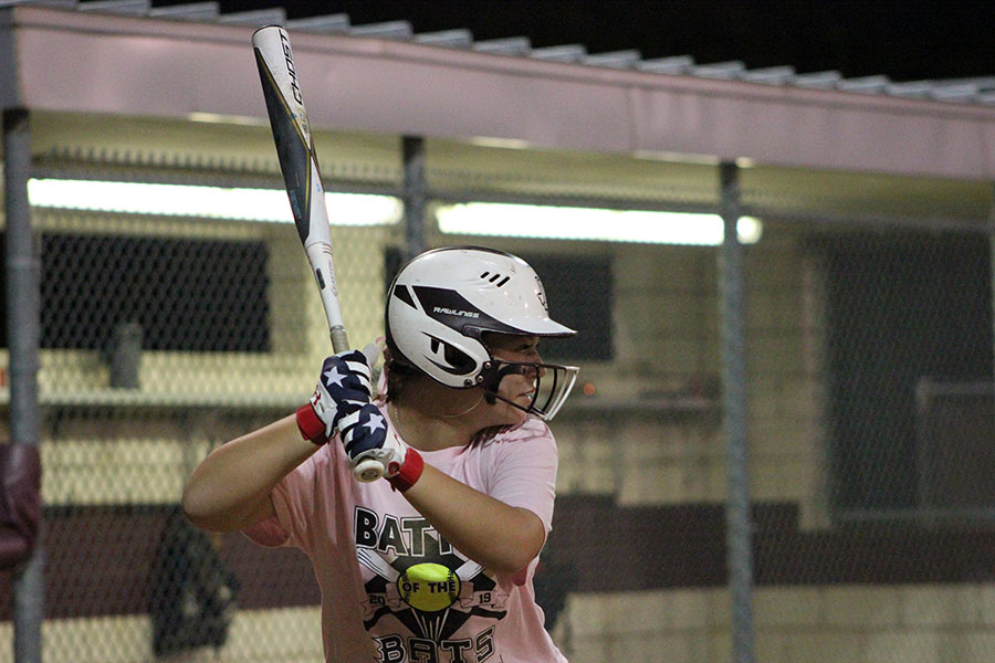 Senior softball captain Allie Barentine focuses on the pitcher as she prepares to swing during the Battle of the Bats game on Wednesday, Oct. 23.