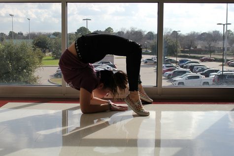 Sophomore contortionist Kiera Conner focuses on balancing on her elbows.