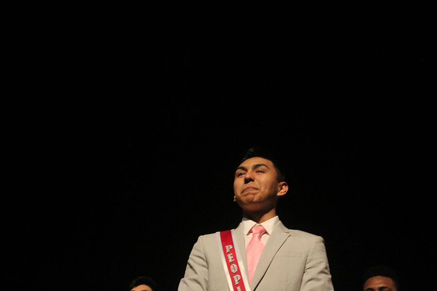 Smiling after being named as Peoples Choice, senior Roberto Martinez walks forward.