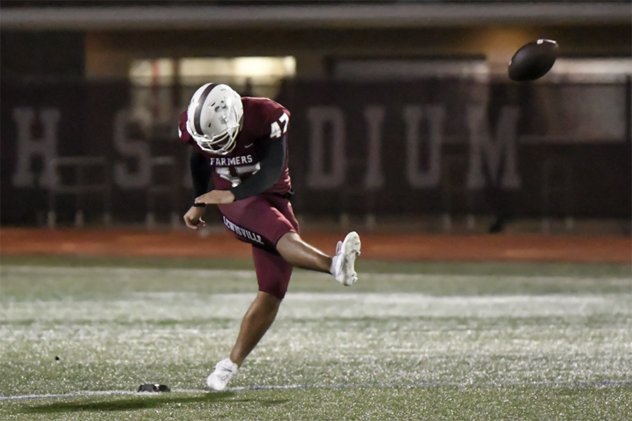 Senior kicker Hector Calderon (47) kicks the ball during the game against Irving Nimitz on Friday, Oct. 25. The Farmers won the game 56-7. Photo courtesy of Nick Olla.