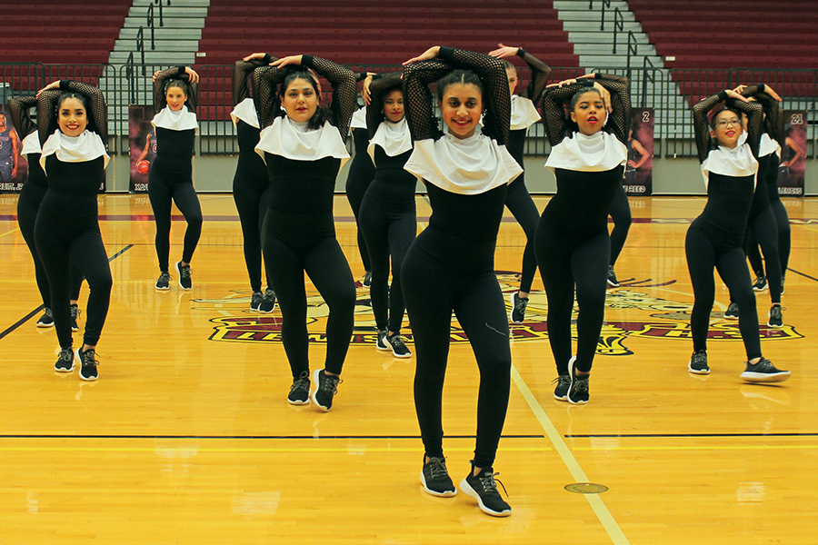 Sophomore Jamaya Jacobs leads the JV Farmerettes in their team hip-hop dance.