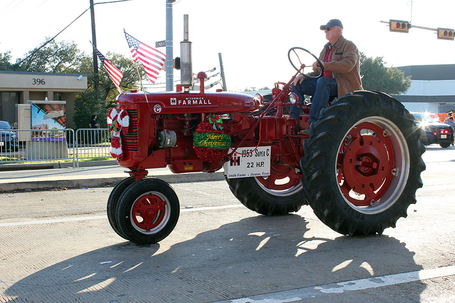 A decorated tractor goes through the parade.