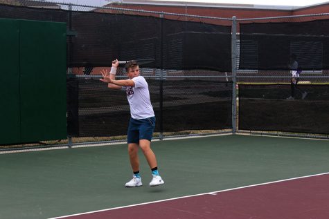 Sophomore Cooper Hopkin prepares to hit a forehand during practice on Monday, March 2. 