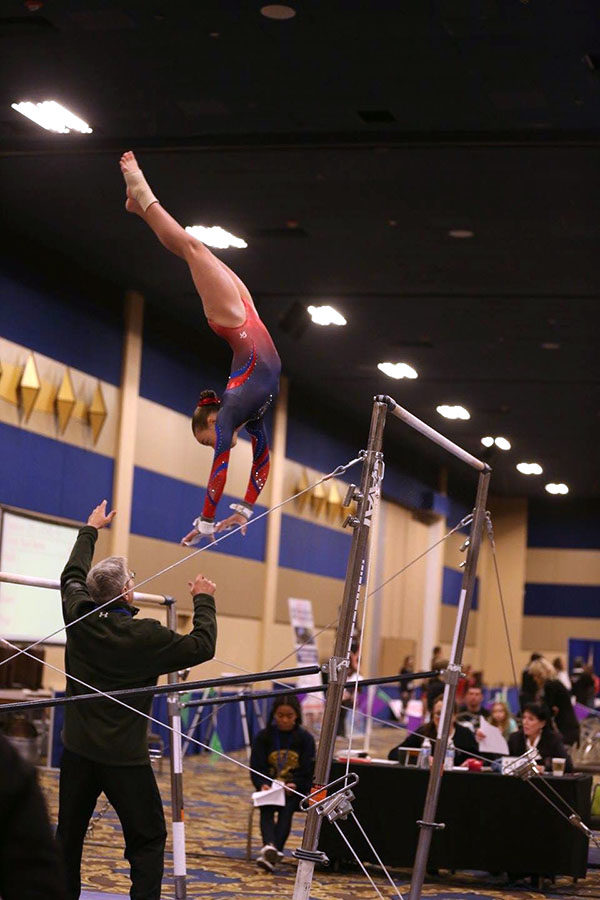 Naomi competes on bars. Courtesy of Ellie Murphy.