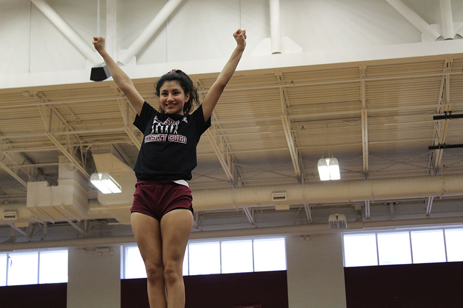 Junior varsity cheerleader Reyna Torres practices during third period on Wednesday, Jan. 15 for the upcoming competition. 