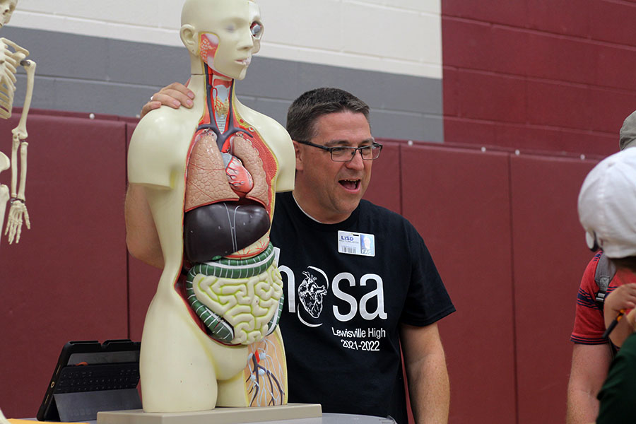 Dr.Lancaster working on the anatomy booth. 