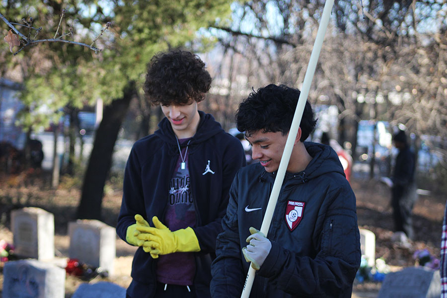 Students volunteer to participate in the clean-up at Champion-Macedonia Cemetery.