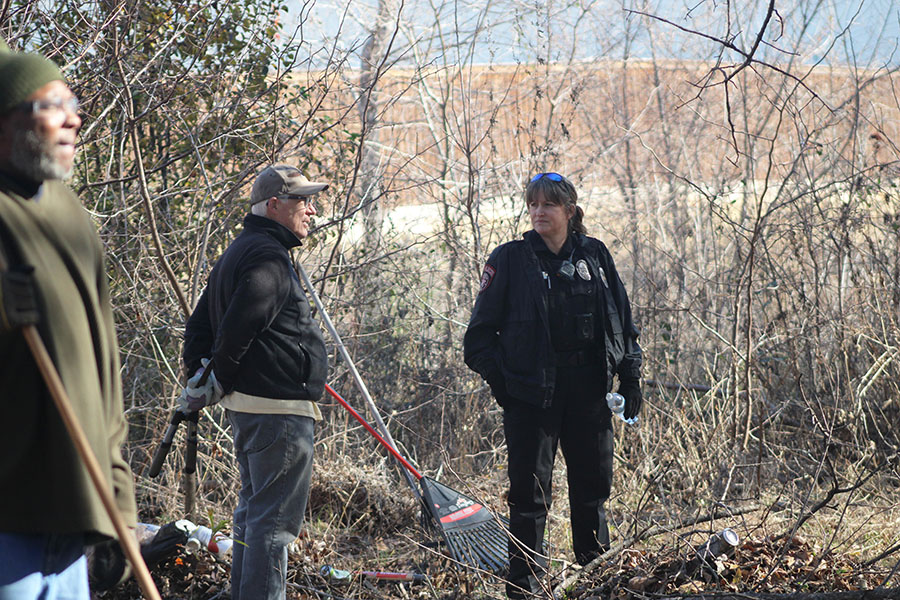 Officer Marni Hull volunteers at the clean-up event on Jan. 17. She assisted the workers and helped clean up the site. This particular site was in desperate need of some attention, Hull said. I think this clean-up is such a fantastic way to bring the community together.