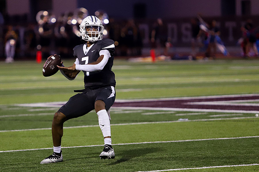 Quarterback Ethan Terrell passes the ball to his offensive players at the game against Highland Park on Friday, Sept. 2.