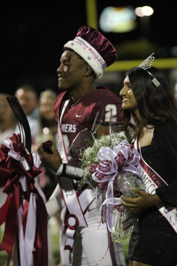 Seniors Cameron Jenkins and Sonika Harish are elected homecoming king and queen after the halftime performance and introduction. 