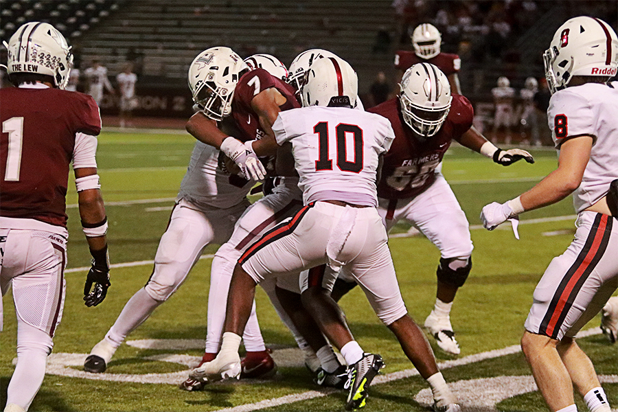 Quaterback Ethan Terrell runs through Coppell defensive players during the second quarter. 
