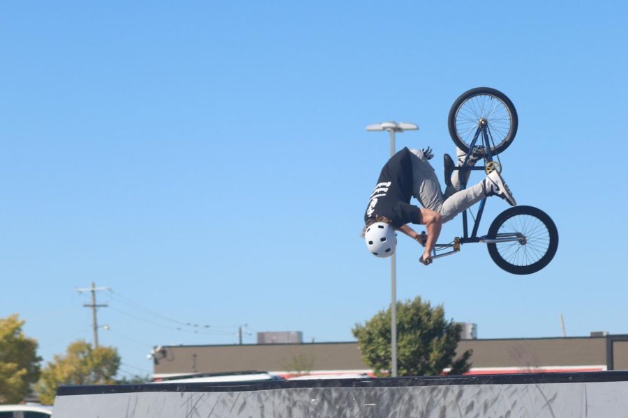 Professional BMX biker Wesley Hark jumps mid-air while on his bike.
