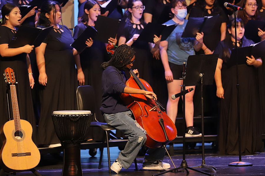 Cellist Naomi Ntuli aides choir in rehearsal and in concert. Later that evening, the varsity orchestra performed “Samson and Delilah” by Camille Saint-Saëns and was featured in “Song of the Wanderer” by Dan Forrest sung by Main Street. 