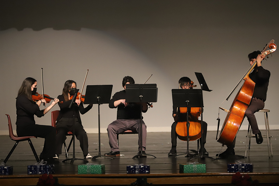 Orchestra members give a short performance after Elites 2000 Miles routine.
