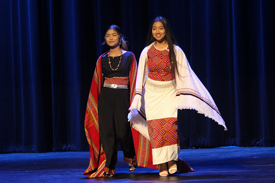 Juniors Mary Sang and Van Mawi represent their modernized take on traditional clothing in the Chin fashion show.