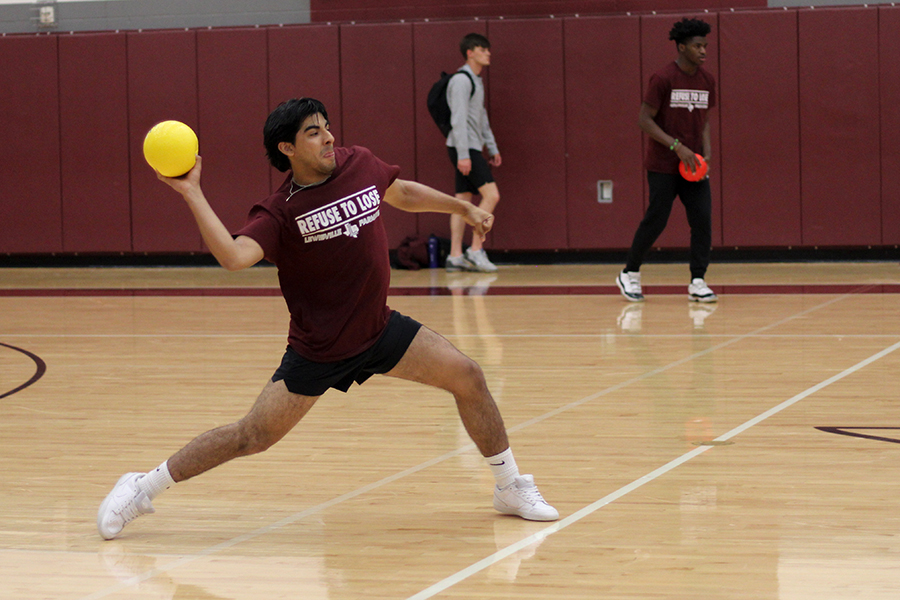 Senior Evan Arroyo plays on team Straw Hats in the second round of the dodgeball match.